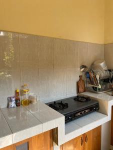 Η κουζίνα ή μικρή κουζίνα στο Homestay Jogja Omah Palagan +7 φωτογραφίες
