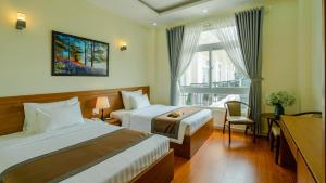 Postel nebo postele na pokoji v ubytování Bombo DaLat Hotel + 37 fotografií