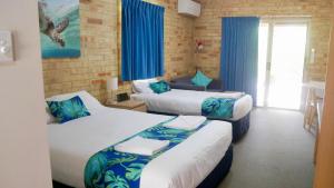 Katil atau katil-katil dalam bilik di Emeraldene Inn & Eco-Lodge