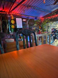 a chair sitting at a table in a restaurant at Dream Vision Guest House in Diu