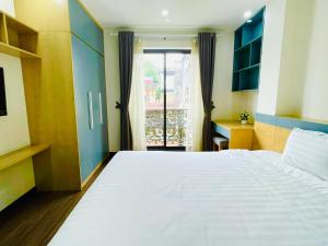 Postel nebo postele na pokoji v ubytování Hotel De La Seine