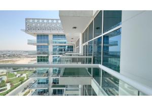 an office building with a view of a city at HomesGetaway-Cozy Studio in Glitz 1 by Danube in Dubai