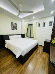 Postel nebo postele na pokoji v ubytování Hotel De La Seine