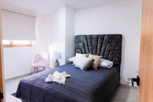 Giường trong phòng chung tại Apartamento 202 - Vista a la Represa - 3 Habitaciones 1 Sofa Cama - Rentas Cortas Gerencial
