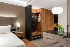 Voodi või voodid majutusasutuse Intercity Hotel Futian Bin He Zhongzhou Bay toas