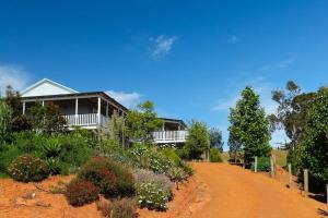 a house on the side of a dirt road at Gorgeous apartment - pet friendly, stunning views in Bridgetown