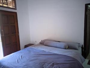 Postel nebo postele na pokoji v ubytování K'Ajeng Cottage