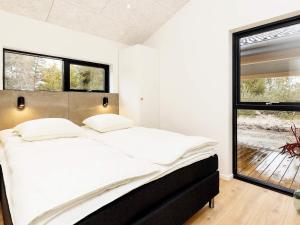 Postel nebo postele na pokoji v ubytování Holiday home Ålbæk VII