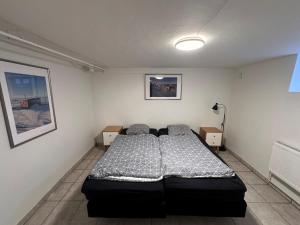 a bedroom with a bed in a room at Nice apartment in Odense in Odense