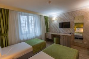 Postel nebo postele na pokoji v ubytování Hotel Corvaris + 36 fotografií