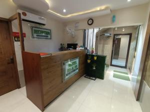 a lobby of a hospital with a reception counter at Hotel Regal Inn Andheri - Nearest Mumbai Airport T1 in Mumbai