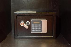 a miniature phone with a cigarette in it at Villa Harry in Moşniţa Nouă