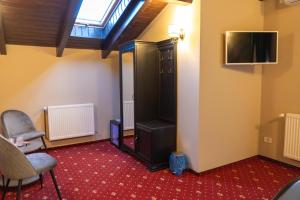 TV a/nebo společenská místnost v ubytování Villa Harry