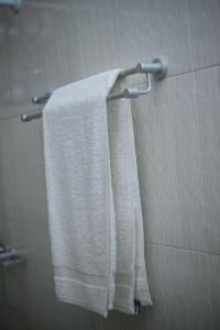 a towel hanging on a towel rack in a bathroom at Kilimanjaro poa in Moshi