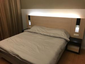 Ένα ή περισσότερα κρεβάτια σε δωμάτιο στο Swiss Garden Residence 1 Bedroom Suite