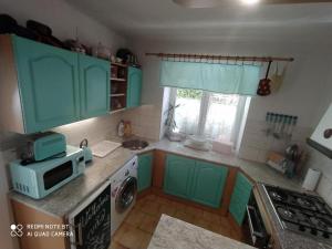 Kuchyňa alebo kuchynka v ubytovaní Apartmány Friday