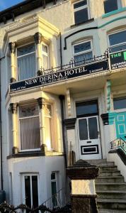 a new derniya hotel sign on the side of a building at New Derina Hotel in Blackpool