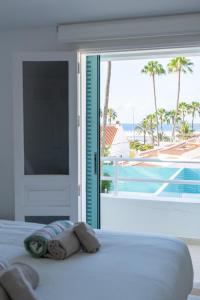 Ένα ή περισσότερα κρεβάτια σε δωμάτιο στο Vivienda Vacacional Pasito Blanco 2