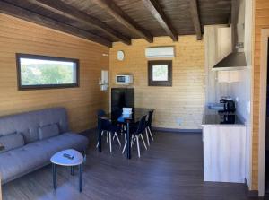 a living room with a couch and a table at A Quinta de Bouzas in Mazaricos