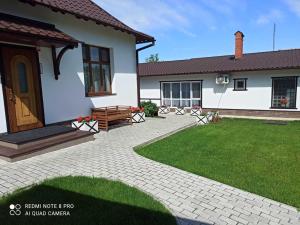 a house with a patio and a lawn at Житловий будинок in Bilhorod-Dnistrovskyi