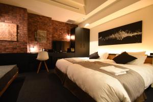 Postel nebo postele na pokoji v ubytování Hotel Risveglio Akasaka