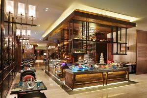 a restaurant with a buffet in the middle of a room at InterContinental Changsha by IHG in Changsha