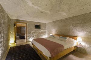 Postel nebo postele na pokoji v ubytování My Cave Suites