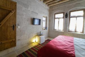 Postel nebo postele na pokoji v ubytování My Cave Suites