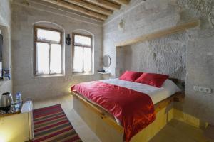 Postel nebo postele na pokoji v ubytování My Cave Suites