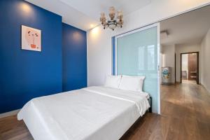 Postel nebo postele na pokoji v ubytování Gold Time Hotel Da Nang