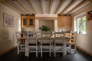 a dining room with a table and chairs at Lake House in Brecon