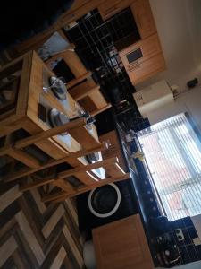 an overhead view of a kitchen with wooden cabinets at Darlington central 3 bed home in Darlington