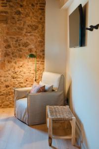 a living room with a couch and a table at Hotel-Masia Can Farrés in El Bruc