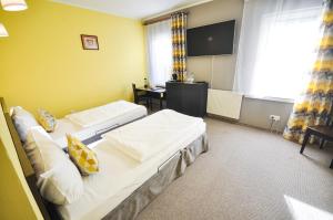 TV a/nebo společenská místnost v ubytování Hotel Trzy Światy Spa & Wellness Rajska WySpa