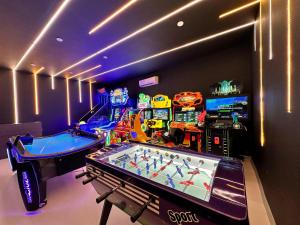 a gaming room with a game table and a video game at Blue Wave Suite Hotel in Alanya