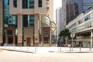 an empty street in a city with tall buildings at Dash Living on Hollywood in Hong Kong