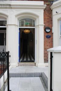 an entrance to a building with a blue door at MOXIE LUXURY APARTMENTS in Belfast