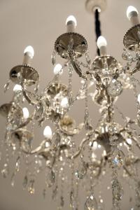 a close up of a chandelier at The White Knight Premium Boutique Hotel in Għajnsielem