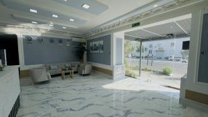 a lobby with a room with a couch and a table at LIANALI HOTEL in Bukhara