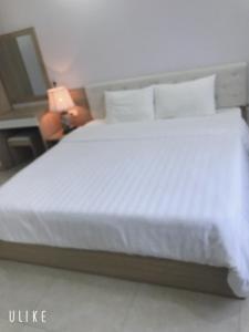 Postel nebo postele na pokoji v ubytování TQ2 Hotel & Apartment