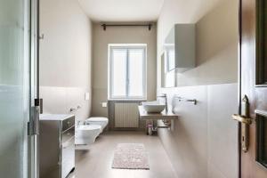a bathroom with a toilet and a sink at Villa Germana in Castenedolo