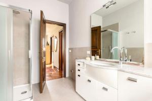 a bathroom with a sink and a mirror at Villa Germana in Castenedolo +36 photos