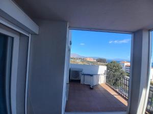 an open balcony with a view of the ocean at Manilva Playa in Manilva