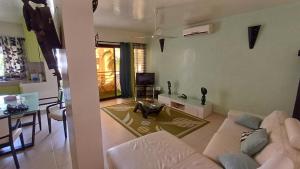 Coin salon dans l'établissement Appartement "AMINA" mit Pool