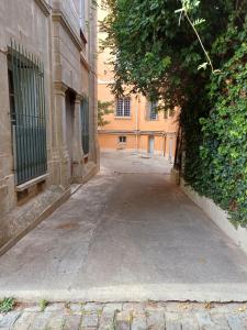 an empty alley with a building in the background at Studio Perpignan in Perpignan