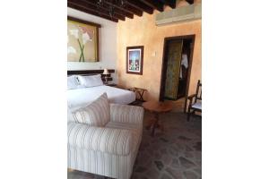 Кровать или кровати в номере Hotel Boutique Posada De Las Flores Loreto