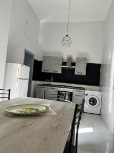 a kitchen with a table with a plate on it at Casa vacanze al castello in Zafferana Etnea