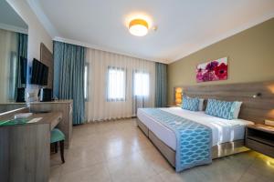 Postel nebo postele na pokoji v ubytování Bodrum Park Resort + 37 fotografií