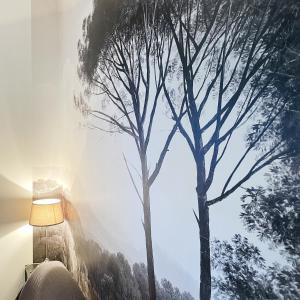 a room with two trees on the wall at Suite Garden by La Boîte En Plus in Senlis +22 photos