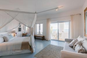 Letto o letti in una camera di Villa Santorini